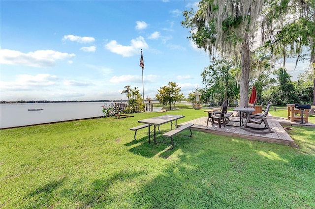 surrounding community featuring a patio area and a lawn