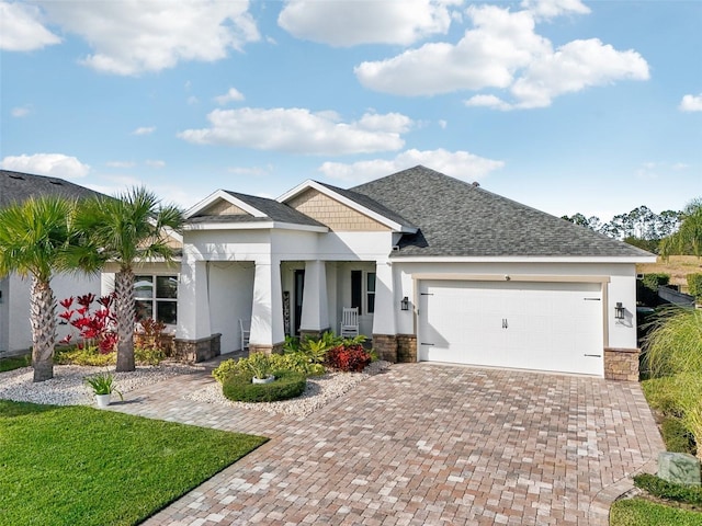 view of front of house featuring a garage and a porch