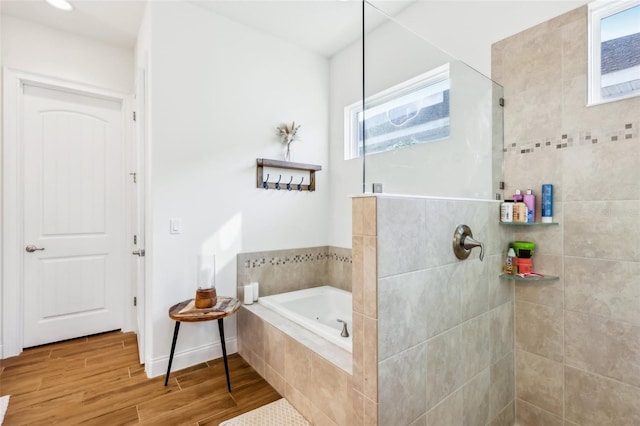 bathroom with separate shower and tub