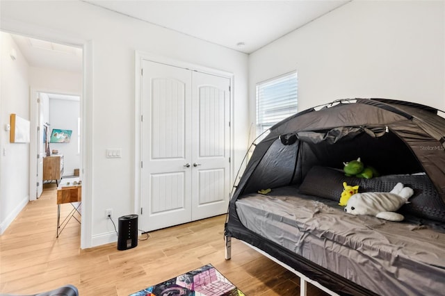 bedroom featuring a closet and hardwood / wood-style flooring