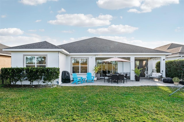 back of house featuring a patio area and a yard