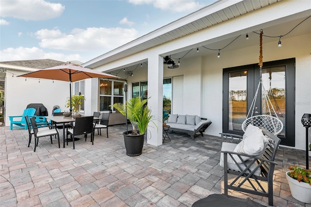 view of patio with an outdoor hangout area and ceiling fan