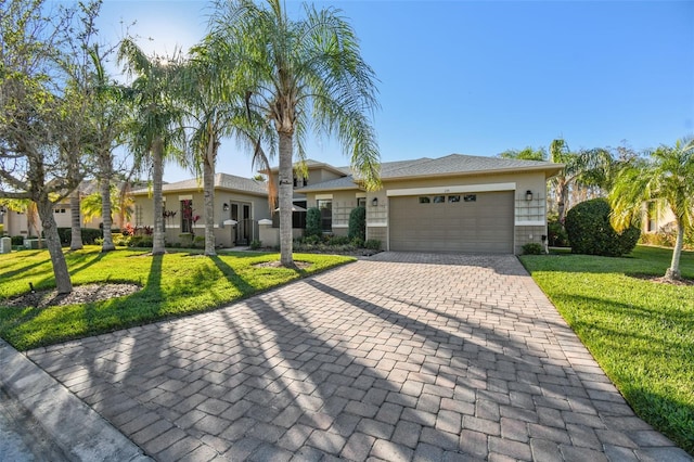 view of front of property featuring a garage and a front yard