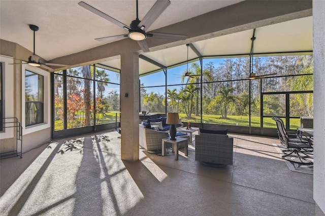 view of patio / terrace featuring outdoor lounge area and glass enclosure