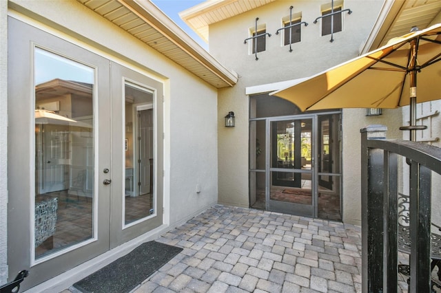 entrance to property featuring a patio and french doors