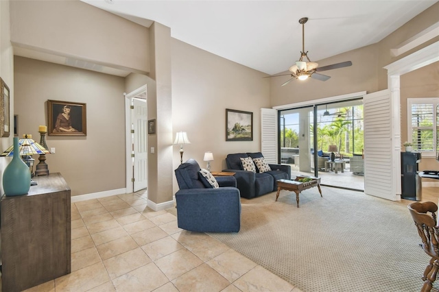 tiled living room with vaulted ceiling and ceiling fan