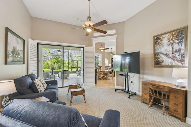 living room with light carpet and ceiling fan