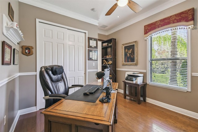 home office featuring hardwood / wood-style flooring, crown molding, a healthy amount of sunlight, and ceiling fan