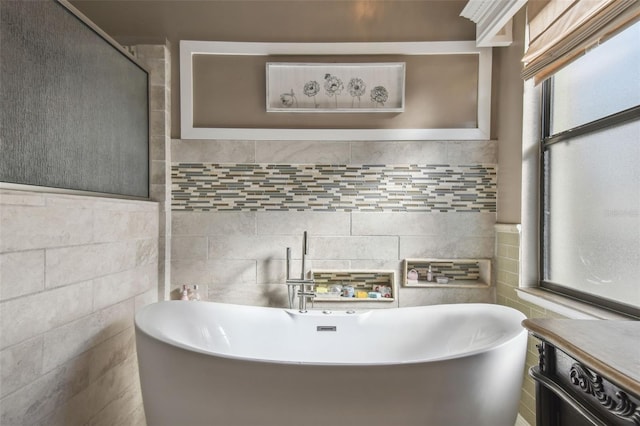 bathroom with tile walls and a tub