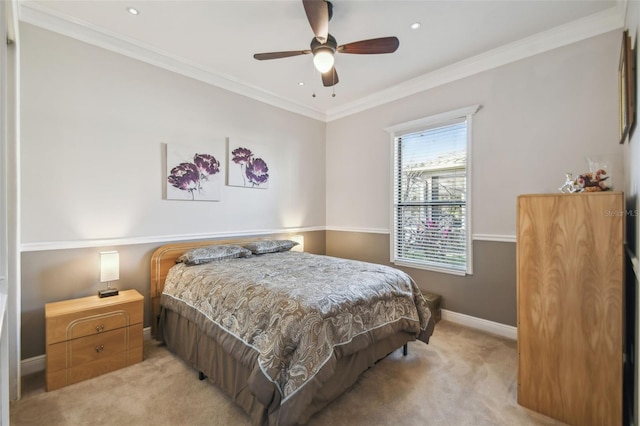 carpeted bedroom featuring ornamental molding and ceiling fan