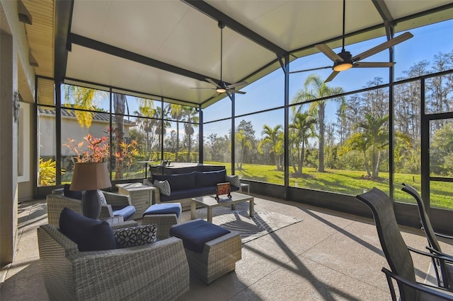 sunroom / solarium featuring ceiling fan