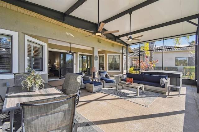 view of patio with an outdoor living space, a hot tub, and ceiling fan