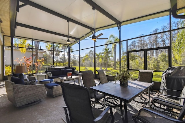 view of patio featuring area for grilling, a lanai, an outdoor hangout area, ceiling fan, and a hot tub