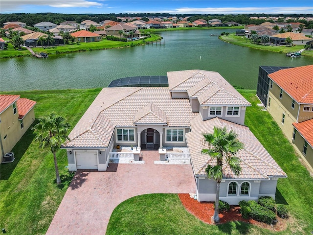 birds eye view of property featuring a water view