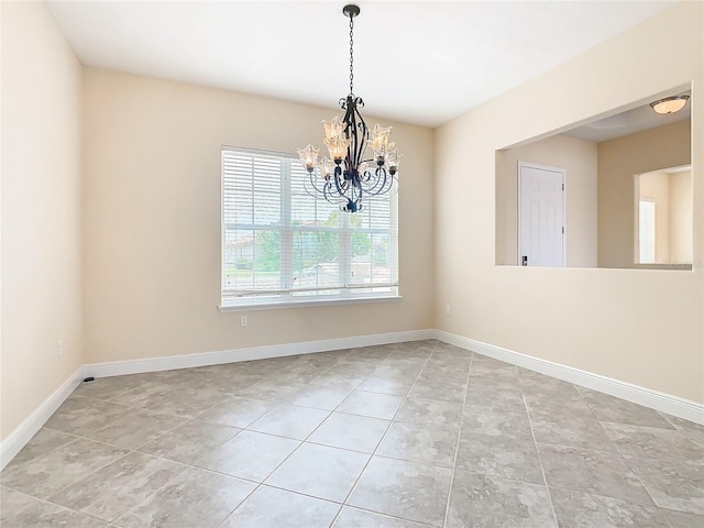 empty room with an inviting chandelier