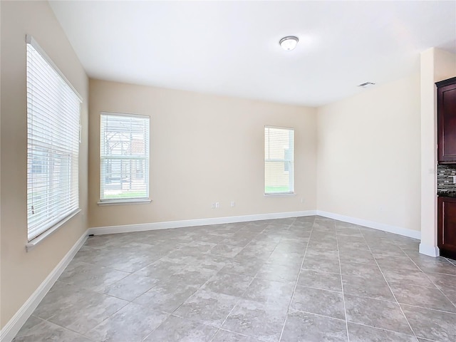 spare room featuring a wealth of natural light