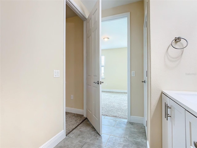 bathroom with vanity and tile patterned floors