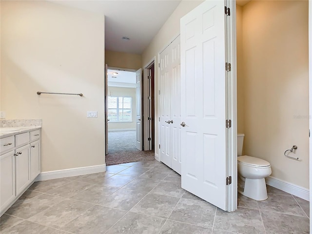 bathroom with toilet and vanity