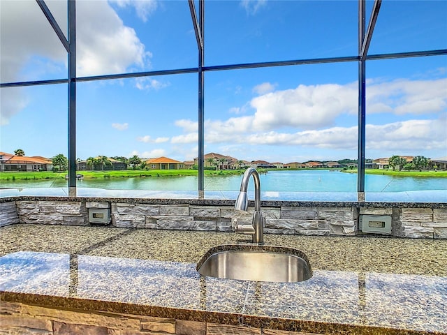 kitchen with sink and a water view