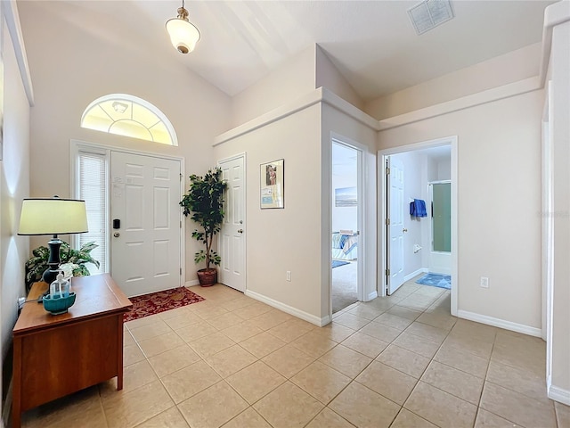 foyer with light tile patterned flooring