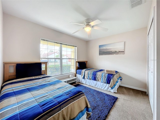 bedroom featuring carpet, a closet, and ceiling fan