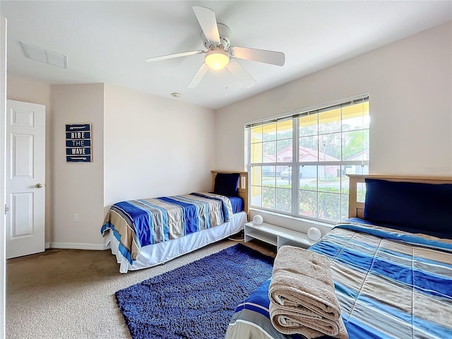 carpeted bedroom featuring ceiling fan