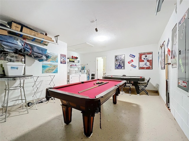 rec room with washing machine and clothes dryer, a textured ceiling, and pool table