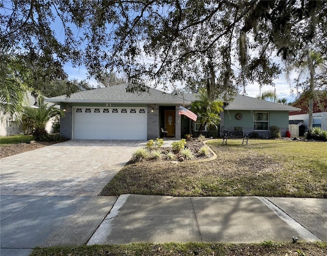 ranch-style home with a front yard and a garage