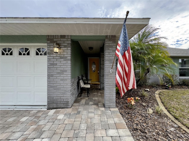 doorway to property featuring a garage