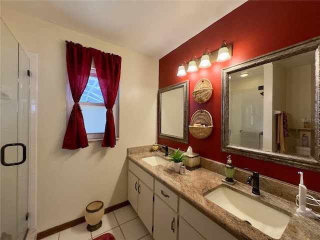 bathroom with vanity, tile patterned flooring, and walk in shower