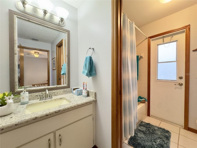 bathroom with tile patterned floors, vanity, and shower / tub combo with curtain