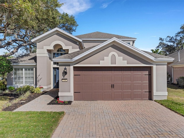 view of front of property featuring a garage