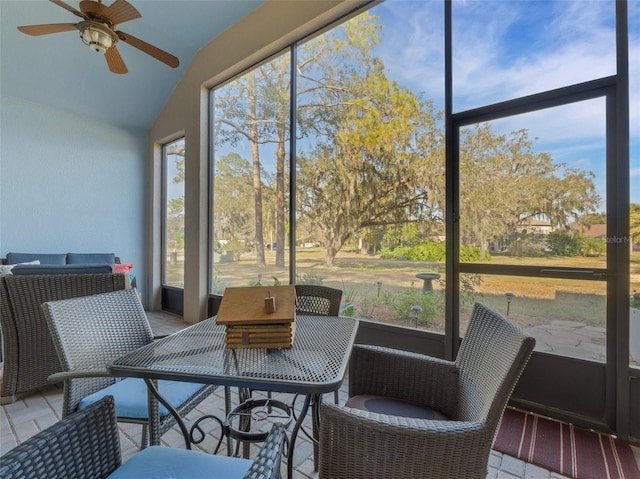 sunroom / solarium featuring vaulted ceiling and ceiling fan