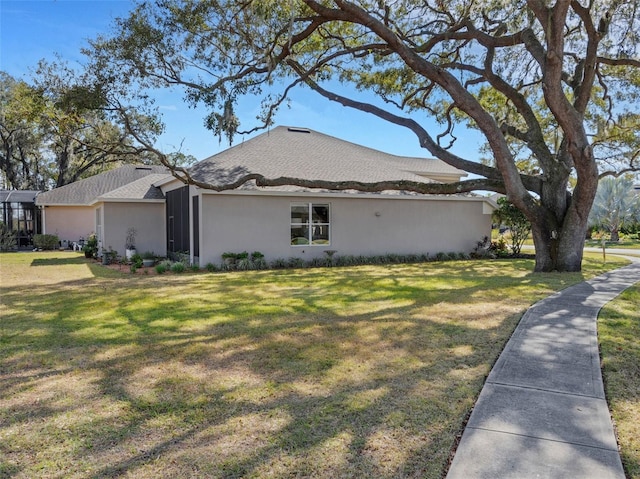 view of property exterior featuring a lawn