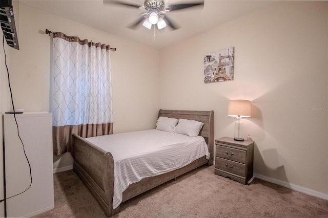 bedroom featuring carpet floors, ceiling fan, and baseboards