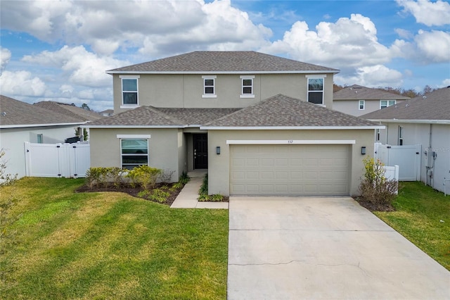 front facade with a garage and a front yard