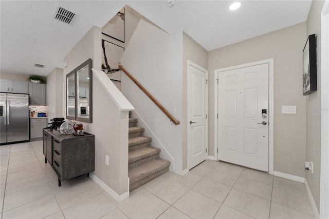 entrance foyer with light tile patterned floors