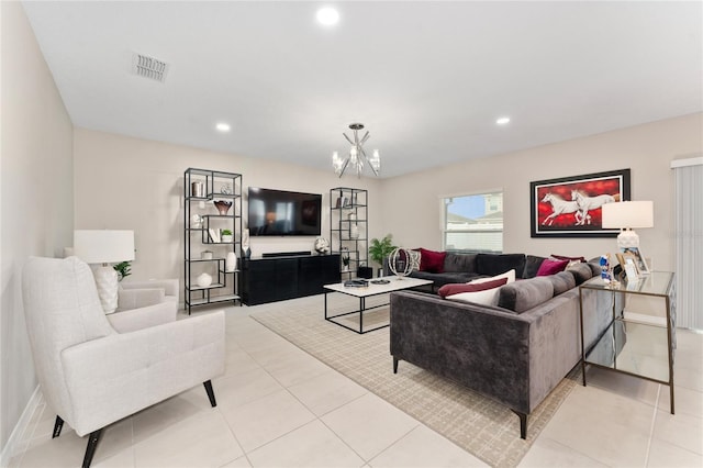 living room with light tile patterned flooring and a chandelier