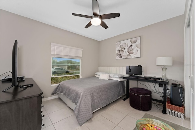 bedroom featuring ceiling fan and light tile patterned floors