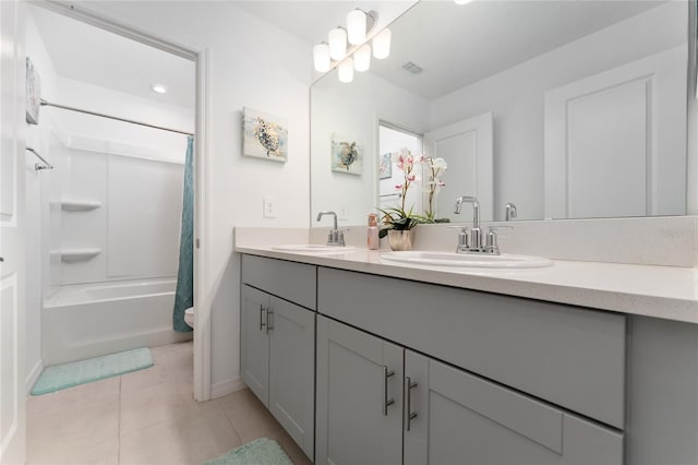 full bathroom featuring toilet, tile patterned flooring, vanity, and shower / bath combo with shower curtain