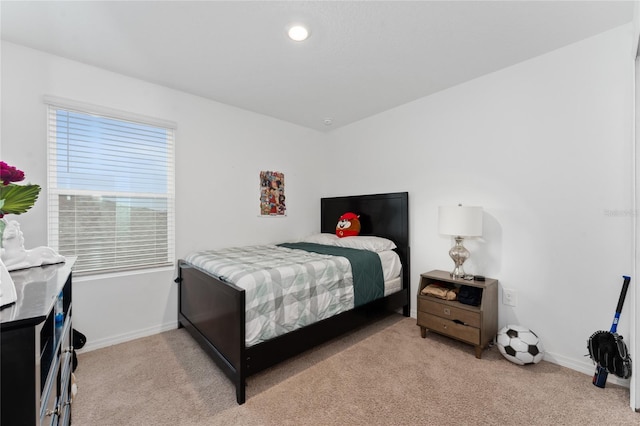 bedroom with light carpet