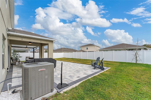 view of patio featuring ceiling fan and central AC