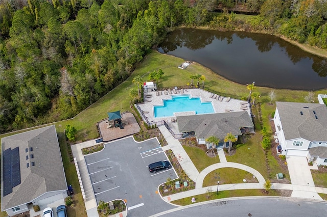 birds eye view of property with a water view