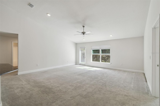 unfurnished living room with light colored carpet and ceiling fan