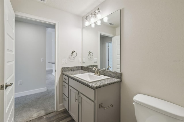 bathroom with vanity and toilet