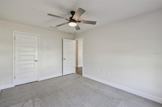 unfurnished bedroom featuring light carpet and ceiling fan