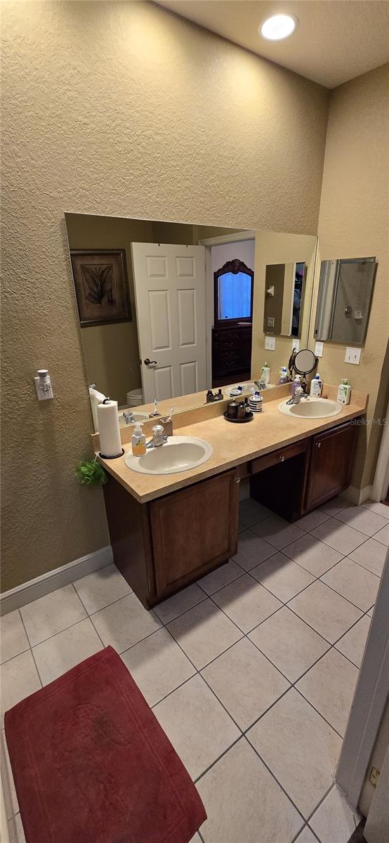 bathroom featuring tile patterned floors and vanity