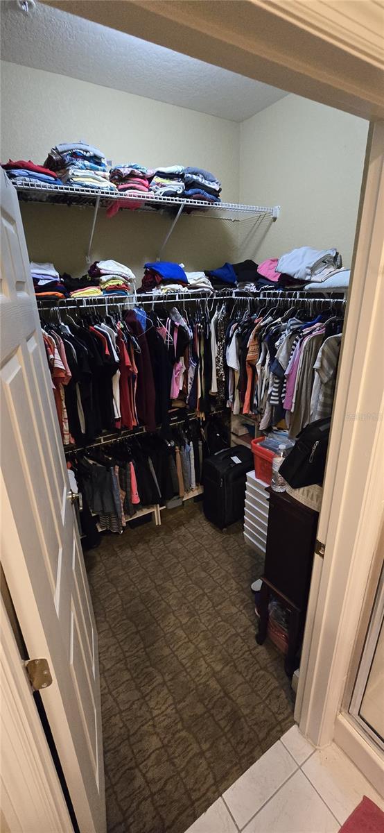 spacious closet with tile patterned flooring