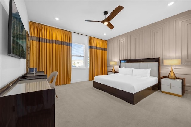 carpeted bedroom with ceiling fan