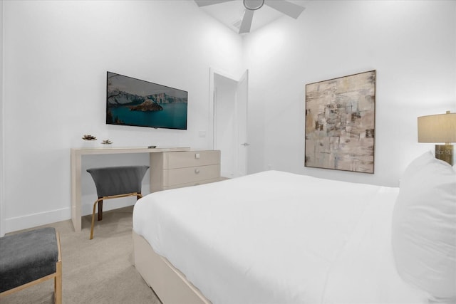 bedroom featuring ceiling fan and light carpet